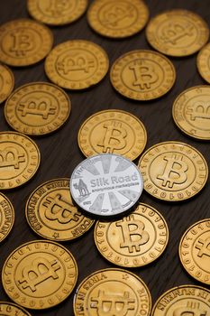 Digital currency physical metal bitcoin coin on the gold money background. Money concept.