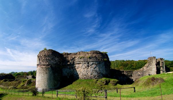 Ruins of Medieval Chateau de Montcornet against Blue Sky in Sunny Day Outdoors. Ardennes, France