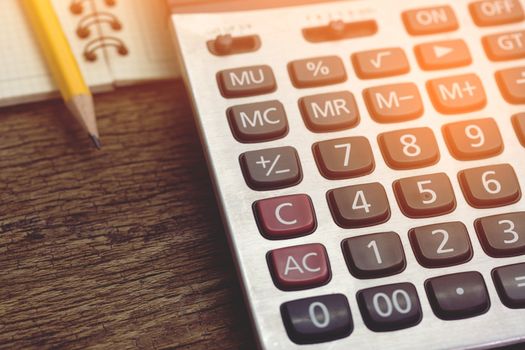 calculator on wood table.