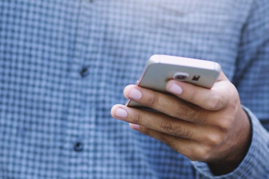 Young Man using mobile smart phone.