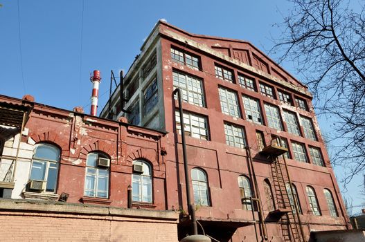 The old industrial building from a brick in the city of Astrakhan