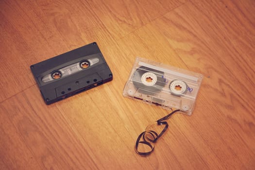 Cases of bygone days. The old cassettes lie on the floor.