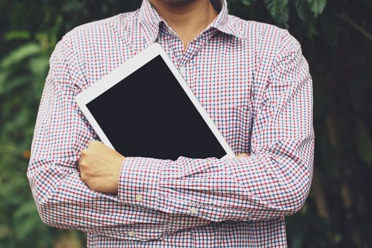 Business man stand hug tablet. or students prepare to learn.