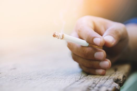 man smoking a cigarette. Cigarette smoke spread.