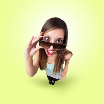 Funny Kissing Girl with Sunglasses looks like caricature of herself, fish eye lens shot
