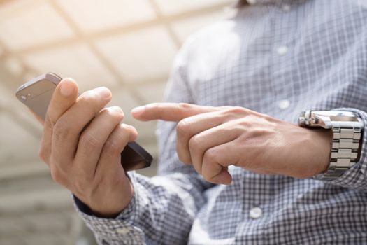 close up of Young Man using telephone. or Business man Contact Customer.