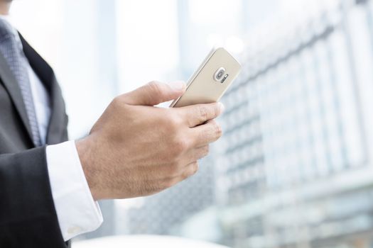 close up of businessman using telephone to contact the job. or Business man Contact Customer.