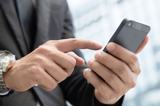 Businessman use smartphones to contact customers