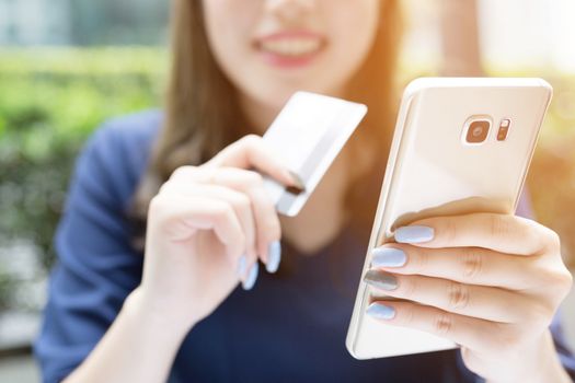 Women use credit cards to shop online.