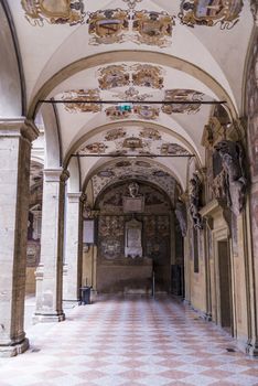 Decorations on the wall and the portico in Archiginnasio library of Bologna. It is one of the most important building on June 25, 2017 in Bologna, Italy.