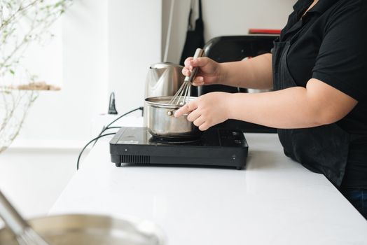 Bakery chef cooking bake in the kitchen professional