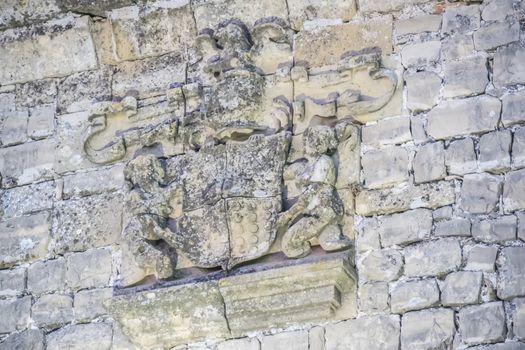 Stone shield detail in the Sabiote village castle, Jaen, Spain