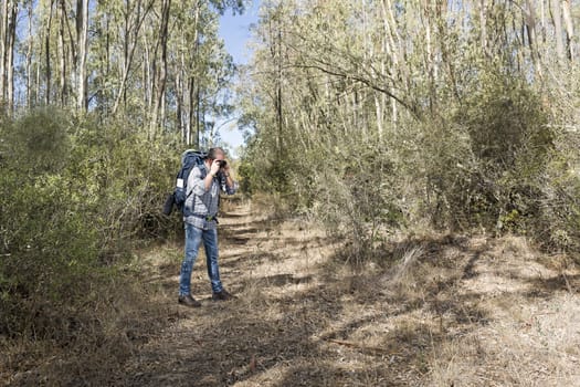 Hiker in the Sardinian Forest with mirrorless camera