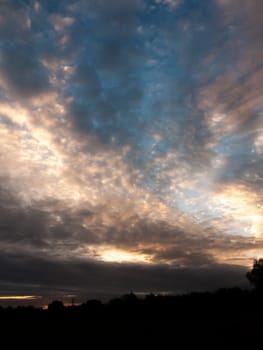 glowing stunning dramatic morning cloudy blue sky overhead space; essex; england; uk