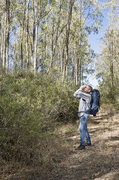Hiker in the Sardinian Forest with mirrorless camera