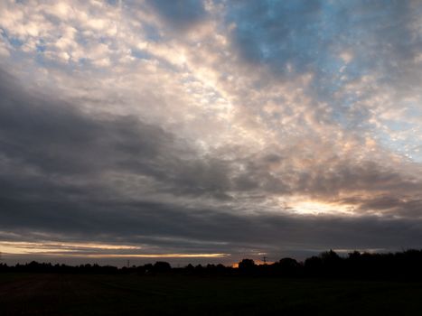 glowing stunning dramatic morning cloudy blue sky overhead space; essex; england; uk