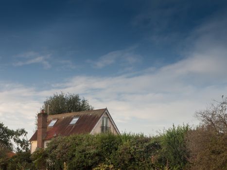 beautiful blue sky over country house outside; essex; england; uk