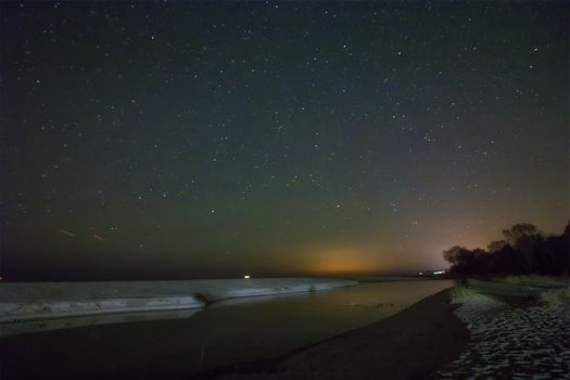 Night sky with stars and sand beach