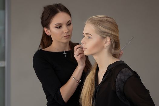 Make-up artist work in her studio. fashion