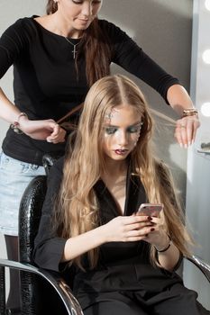 Weave braid girl in a hair salon.