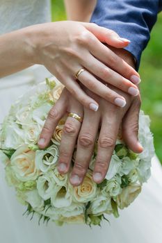 Beautiful wedding bouquet and rings.