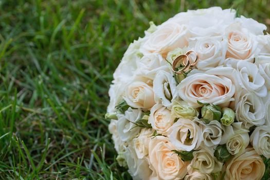 Beautiful wedding bouquet and rings.