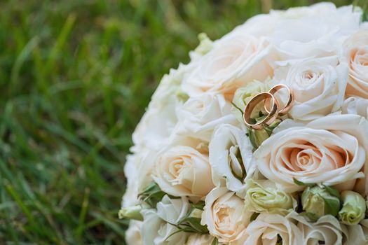 Beautiful wedding bouquet and rings.