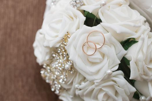 Beautiful wedding bouquet and rings.