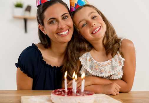 Shot of a mother and daughter in the kitchen celebrating Daughter's birthday