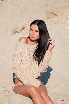 Beautiful girl in a bikini on the beach.