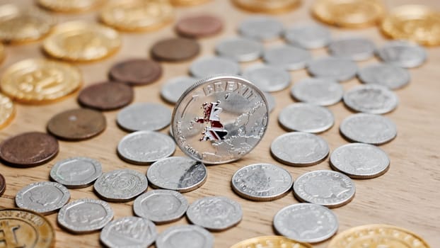 Physical metal silver brexit coin with British map on the front. Europe leaving. Article 50.