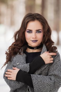 portrait of beautiful young woman smiling in winter time