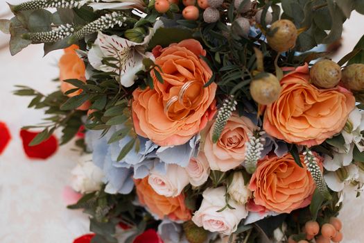 Beautiful wedding bouquet and Beautiful wedding rings.