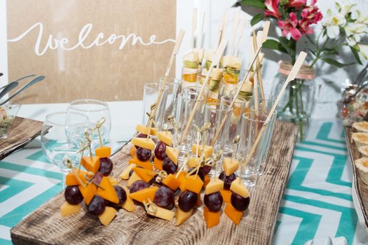 waiters poured into glasses of wine and champagne.