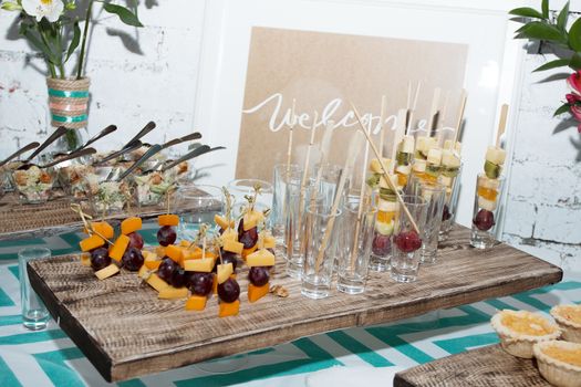 waiters poured into glasses of wine and champagne.