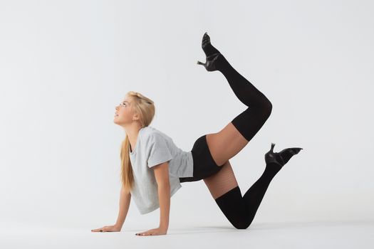 Young girl doing gymnastic exercises isolated. Girl gymnast.