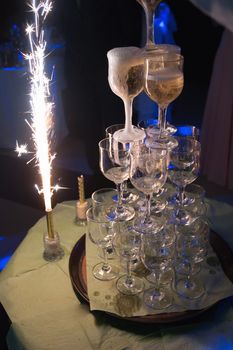 waiters poured into glasses of wine and champagne.