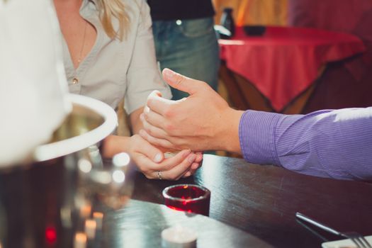 Joyful man making proposal to his future wife.