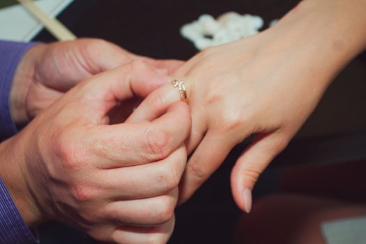 Joyful man making proposal to his future wife.