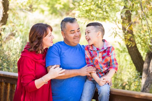 Mixed Race Caucasian and Hispanic Family At The Park.