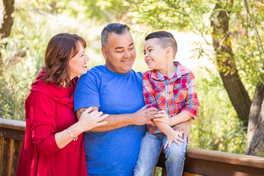 Mixed Race Caucasian and Hispanic Family At The Park.