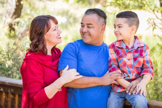 Mixed Race Caucasian and Hispanic Family At The Park.