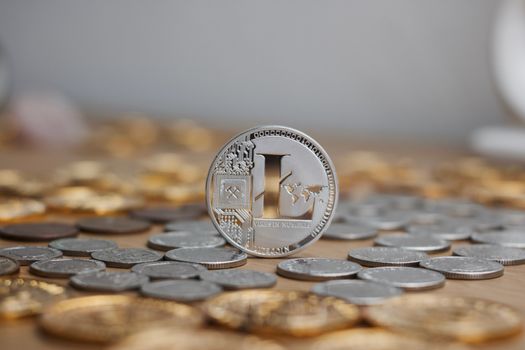 Digital currency physical metal litecoin coin. Cryptocurrency mining concept.