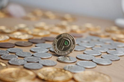 Digital currency physical metal gold peercoin coin. Cryptocurrency concept.