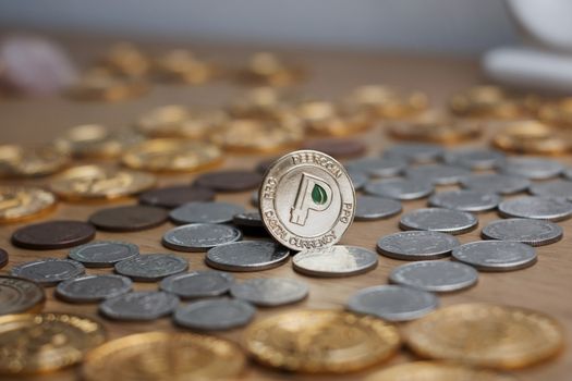 Digital currency physical metal gold peercoin coin. Cryptocurrency concept.