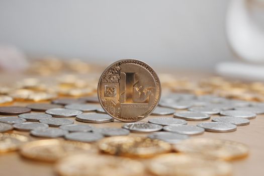 Digital currency physical metal litecoin coin. Cryptocurrency mining concept.
