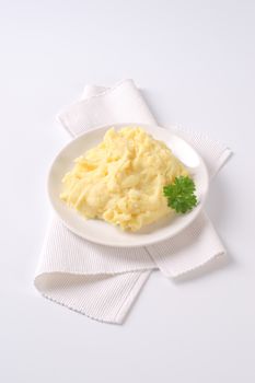 plate of mashed potatoes puree on white place mat