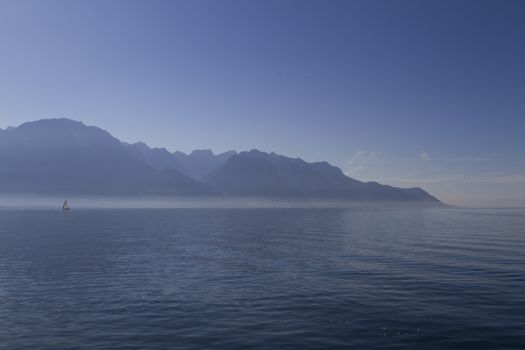 Mountains and Lake Leman and boat in Montreux Switzerland