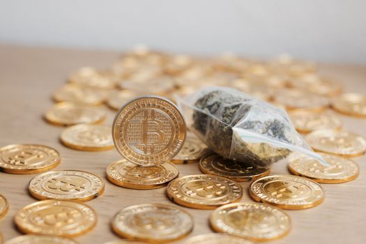 Digital currency physical bitcoin coin. Gold background coins concept.