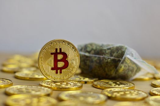Digital currency physical bitcoin coin. Gold background coins concept.